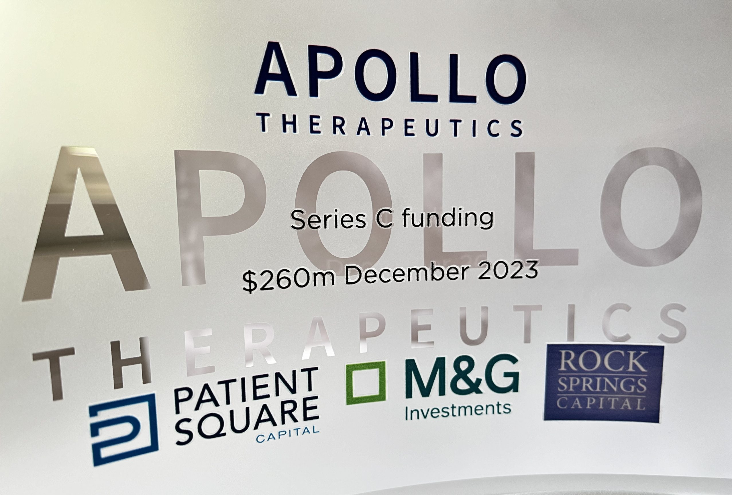 Apollo funding plaque with lead investors displayed