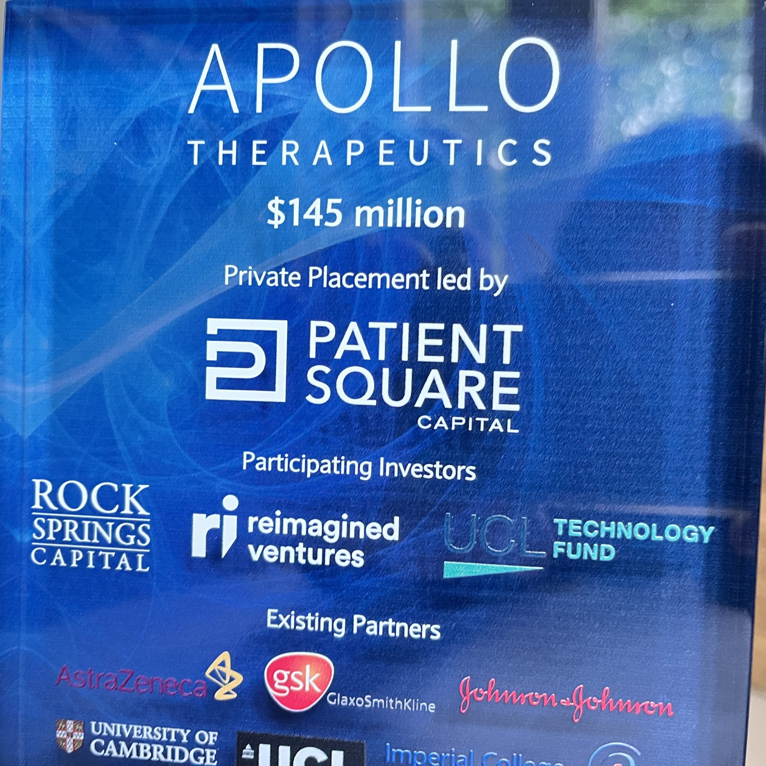 Apollo funding plaque with lead investors displayed