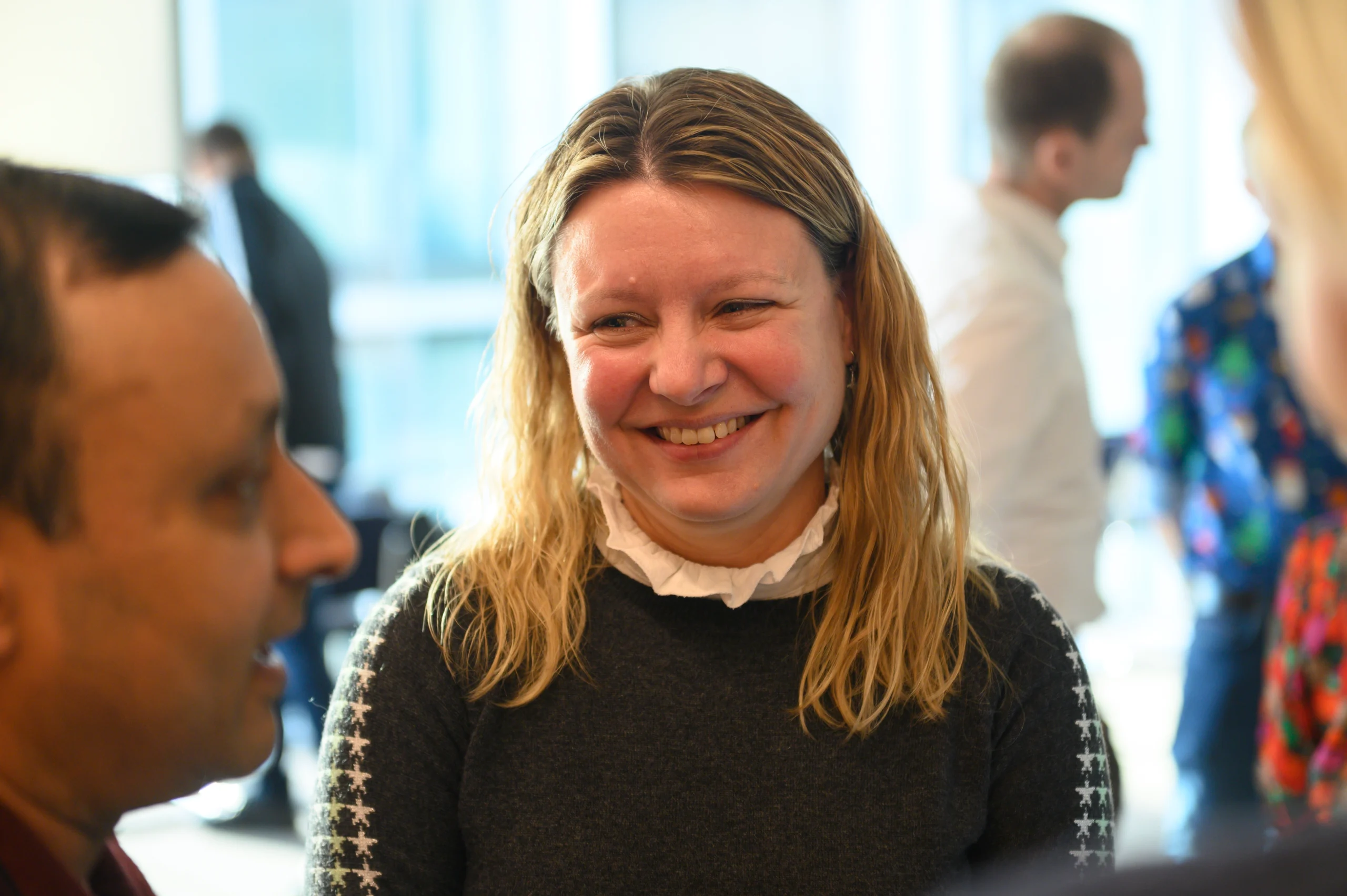 Smiling engaged person listening to others